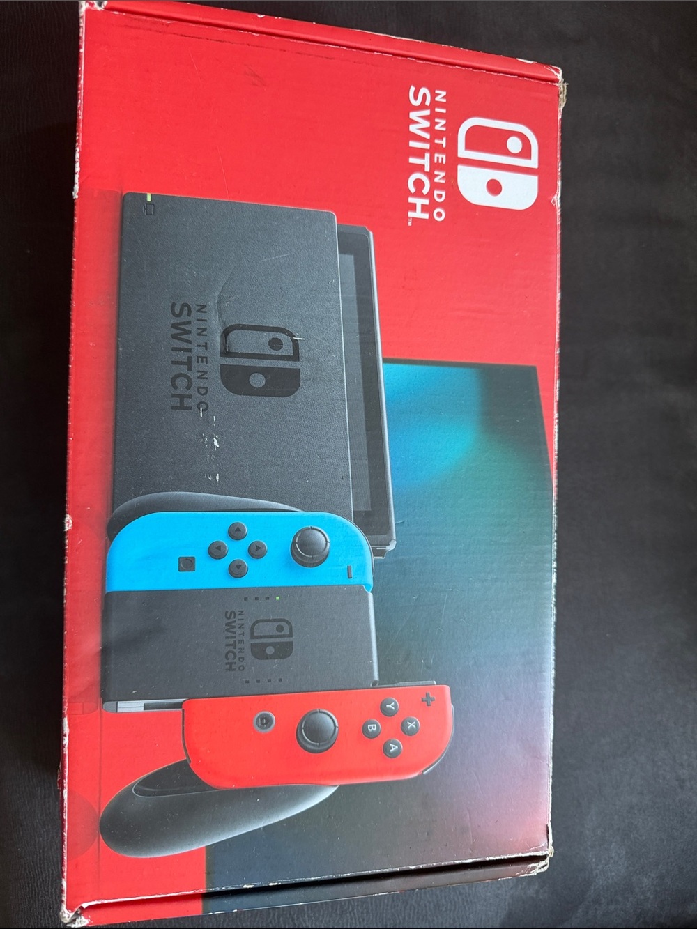Nintendo Switch with Neon Blue and Neon Red Joy‑Con Controllers